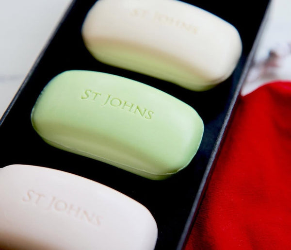 Natural soap set featuring St Johns bars in Lime, Vetiver, and 77 varieties on a neutral display.